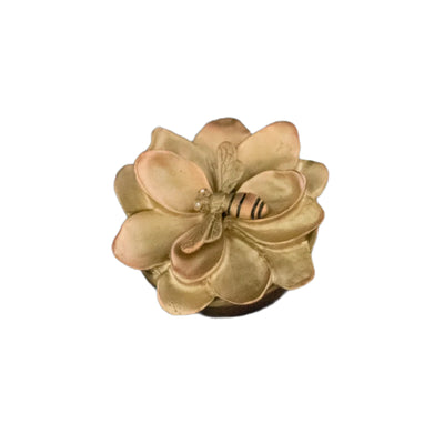 Decorative box with floral design and bee on a black background