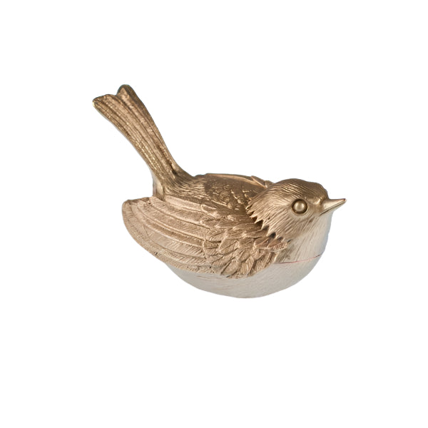 Bronze bird-shaped object on a white background